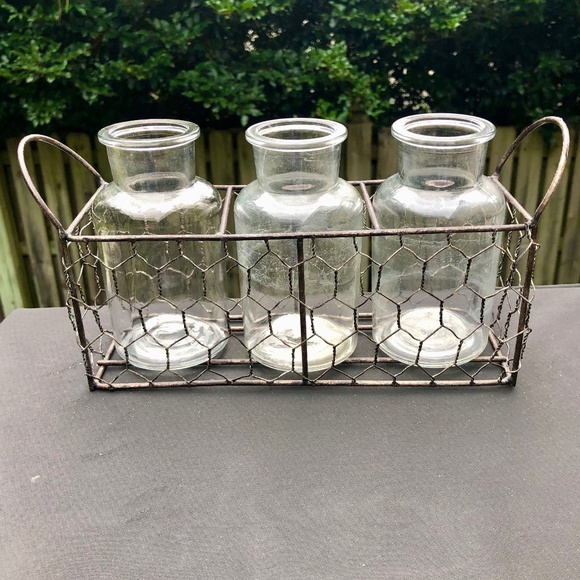 Vintage glass bottle set in wire holder